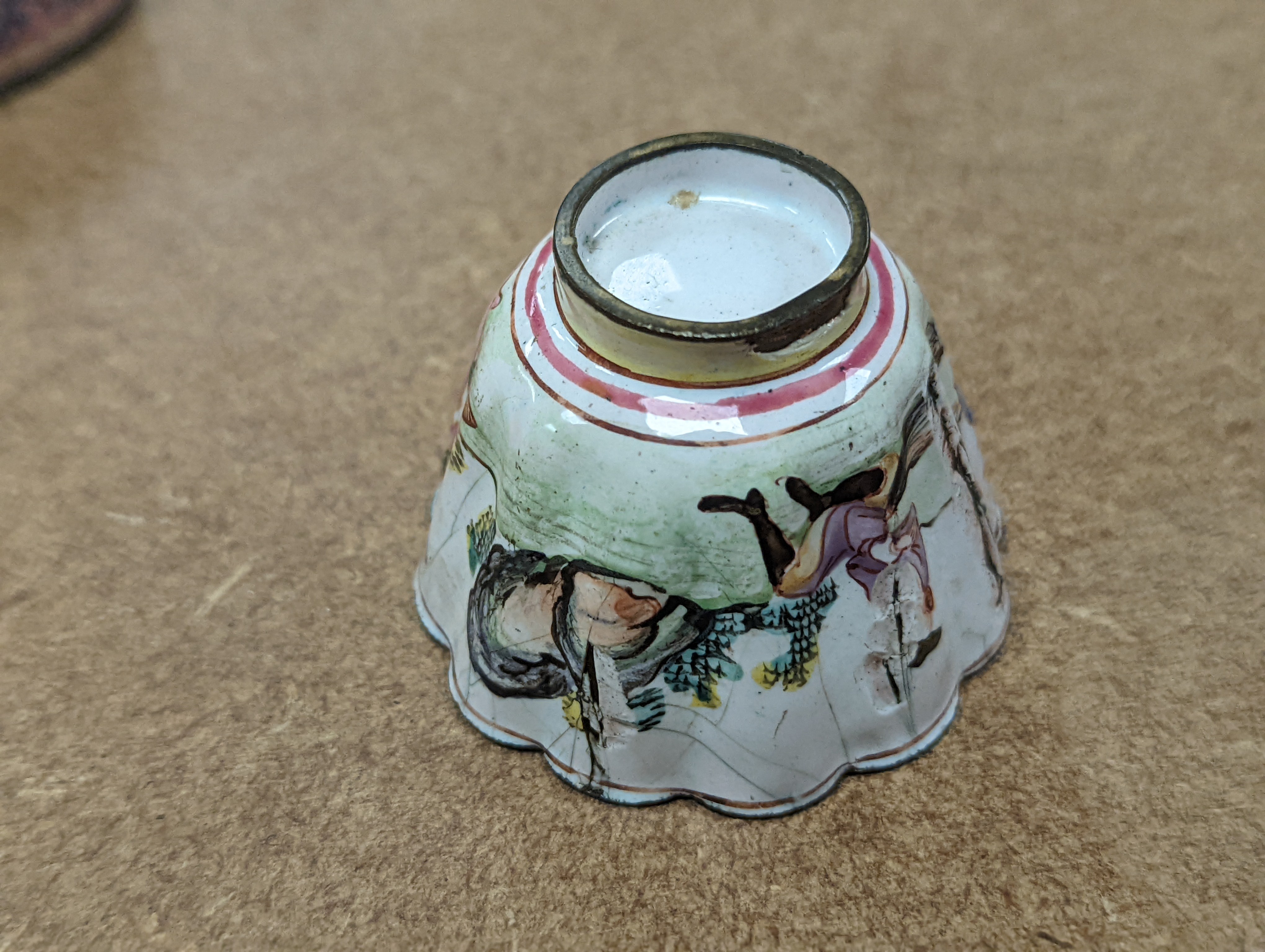 Two 18th century Chinese Canton enamel cups, and a 19th century Canton enamel oval snuff box, 5.8cm
